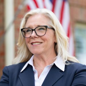 Shannon Taylor with flag in background