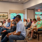 A crowd attends a grassroots candidate event hosted by Neighbors for Change.