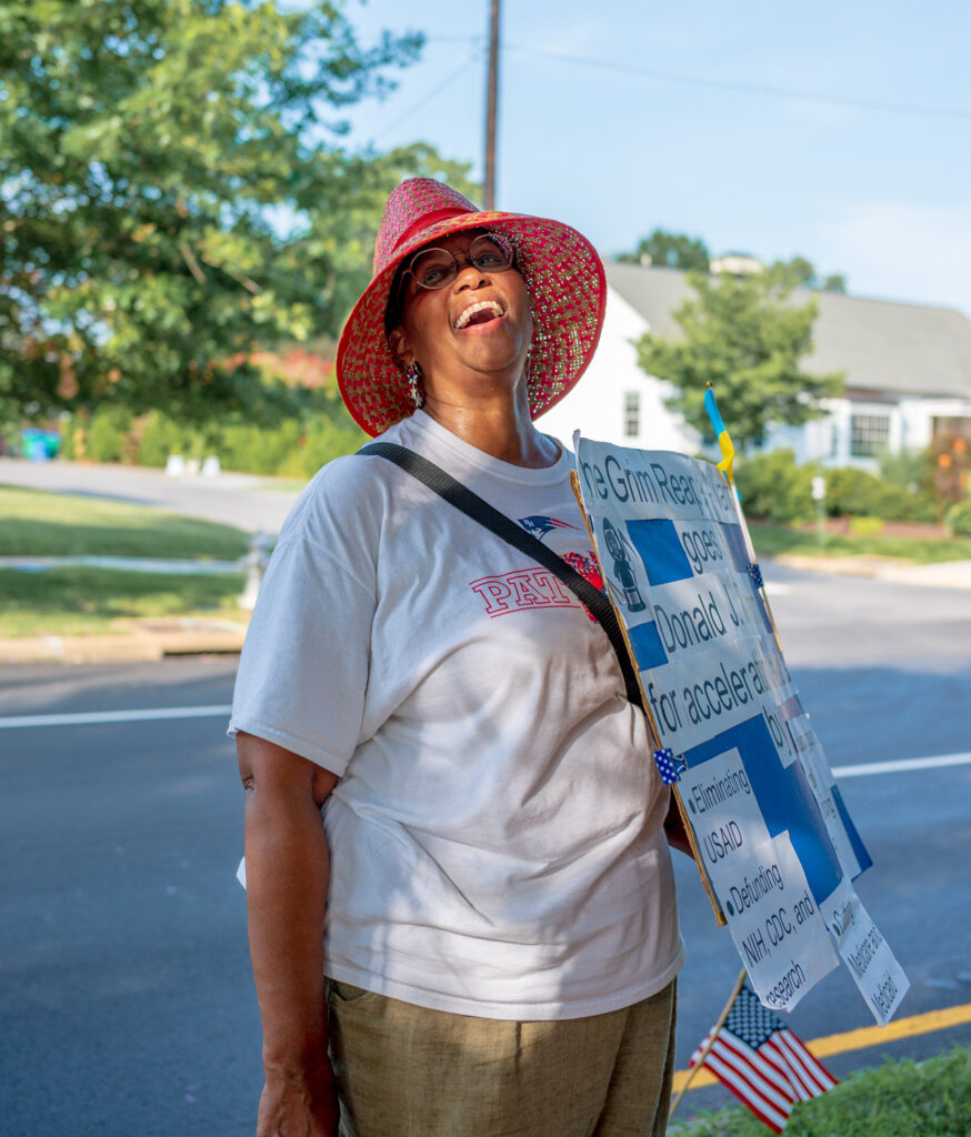 woman laughing at a protest